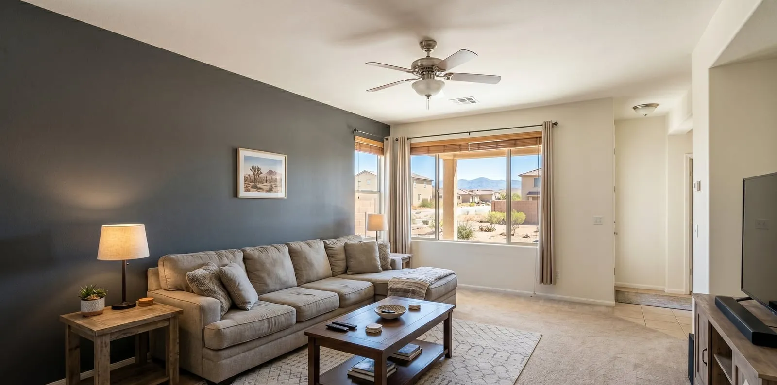 Living room with a bold navy accent wall painted by Maintenance America in Las Vegas