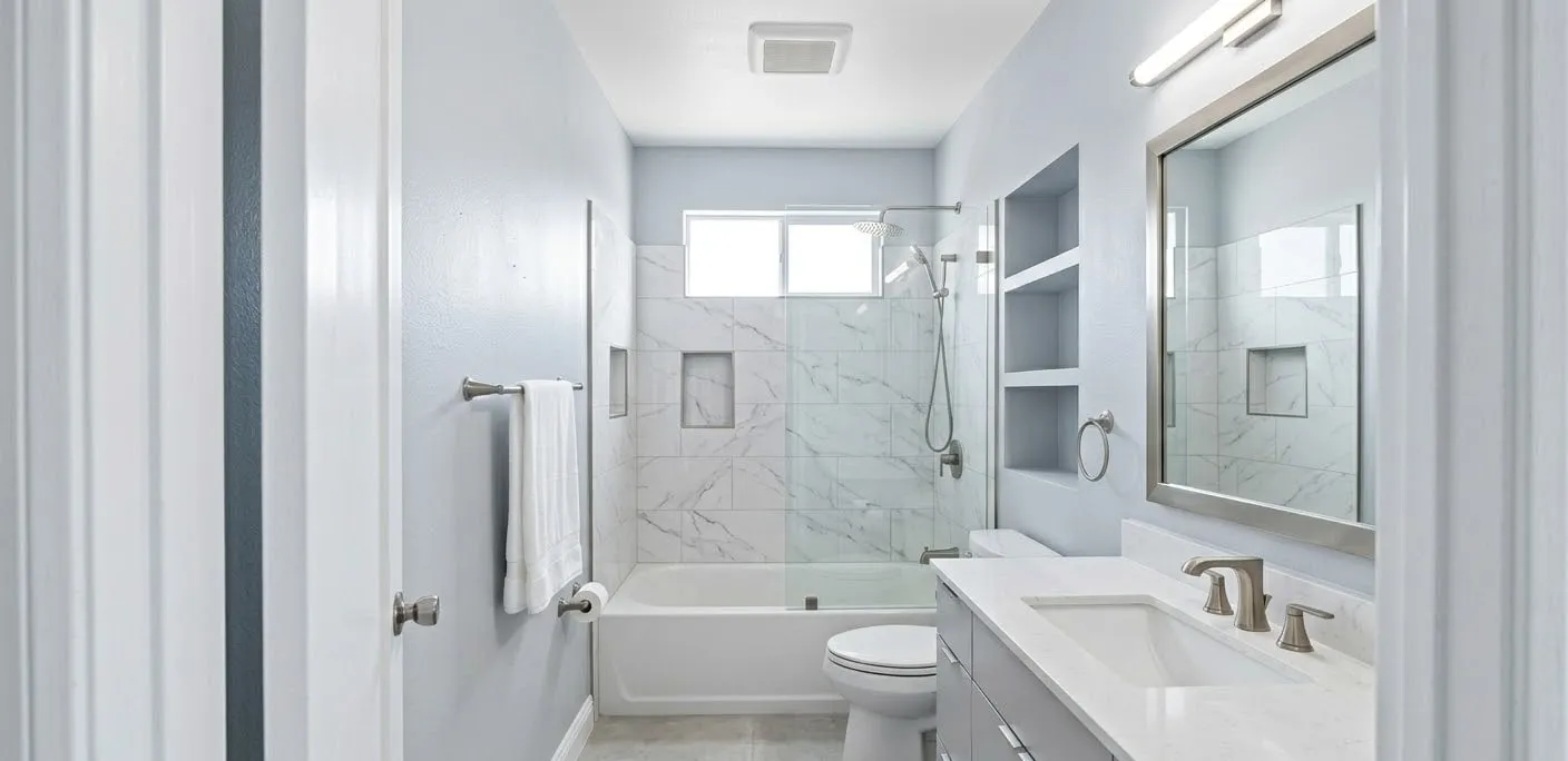 Refreshed guest bathroom with new vanity, tile, and fixtures by Maintenance America